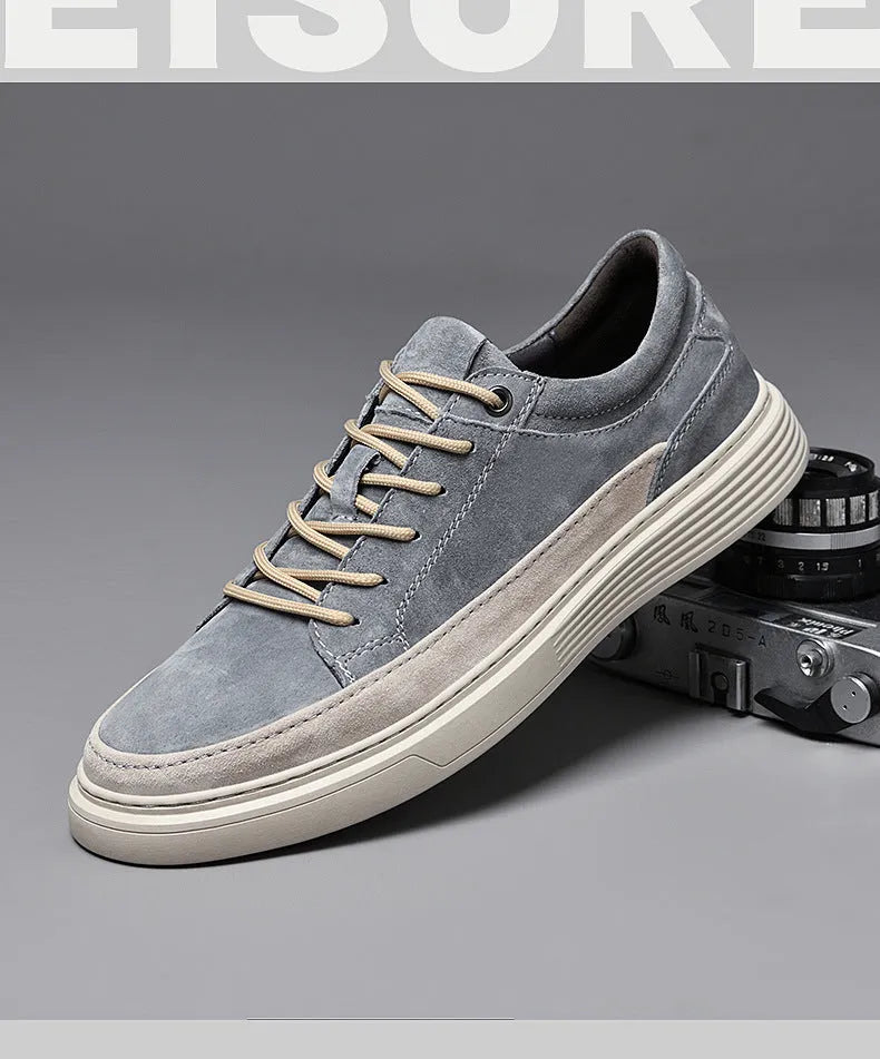 Men's grey casual leather skate shoes with round toe and low-top design on a rubber sole.