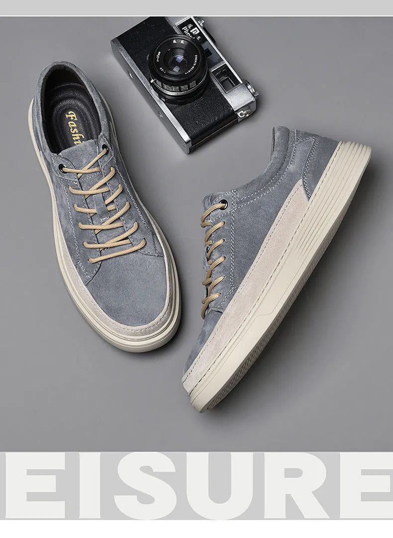 Men's grey casual leather skate shoes with round toe and low-top design on a rubber sole.