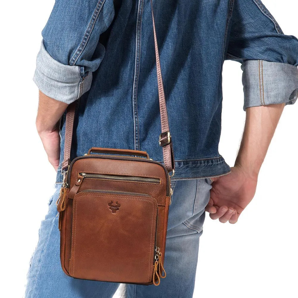 Men's brown genuine leather crossbody bag with single shoulder strap and visible stitching