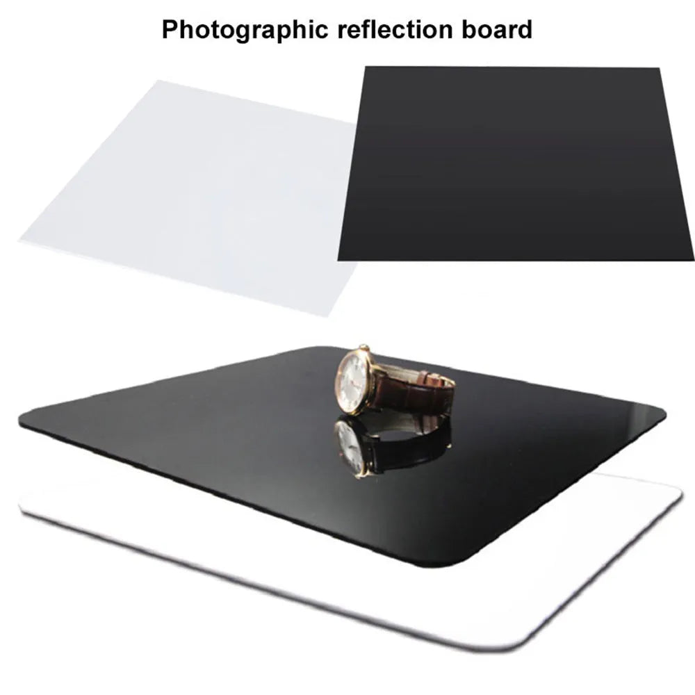 Black and white acrylic square reflection boards for product photography on a table