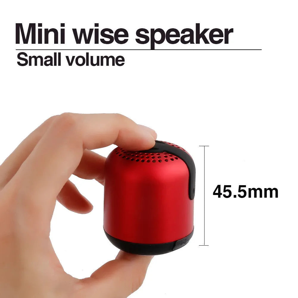 Hieha XQ11 cylindrical wireless Bluetooth speaker in silver colour on a table.