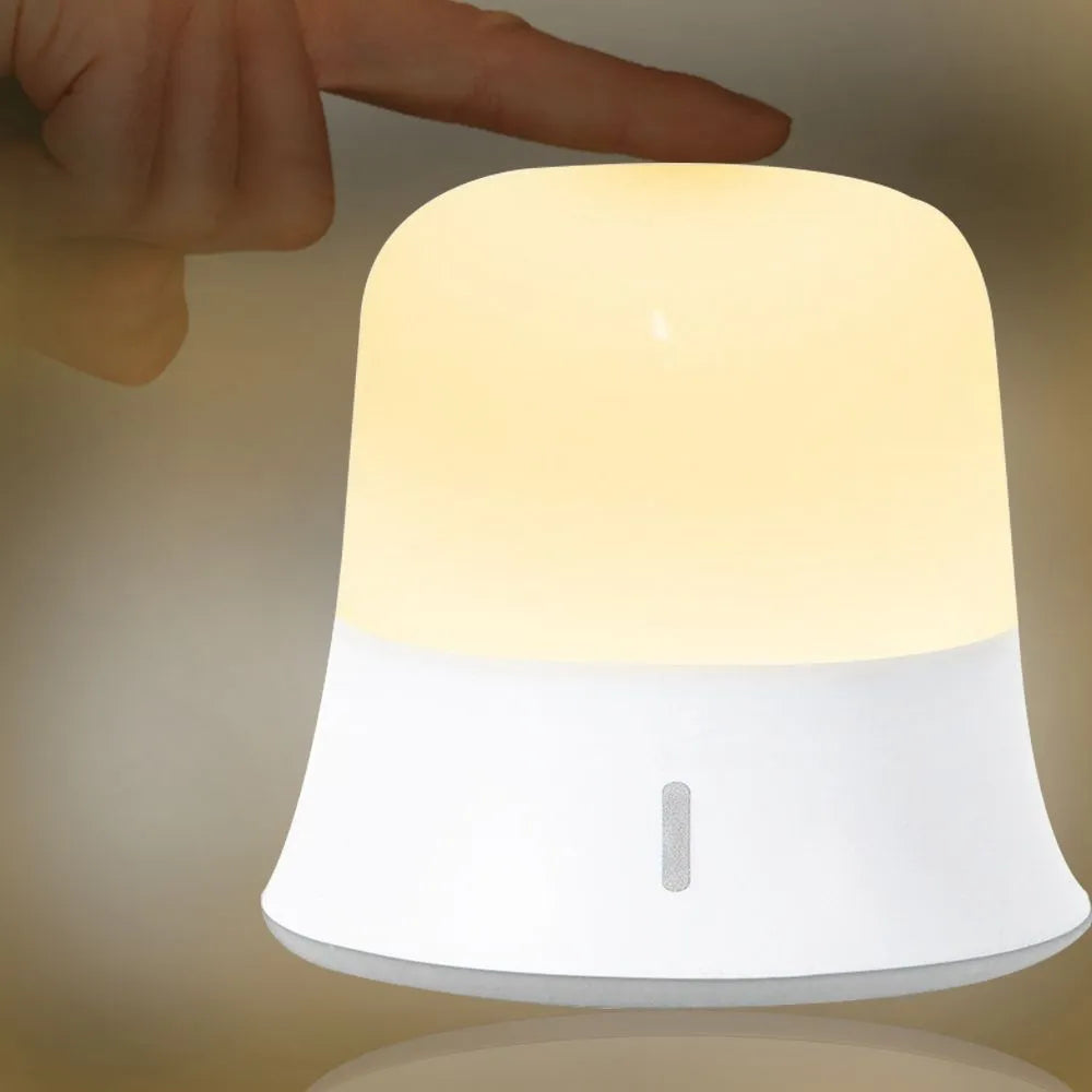 White bedside nursing night light with touch controls showing dimming and colour options