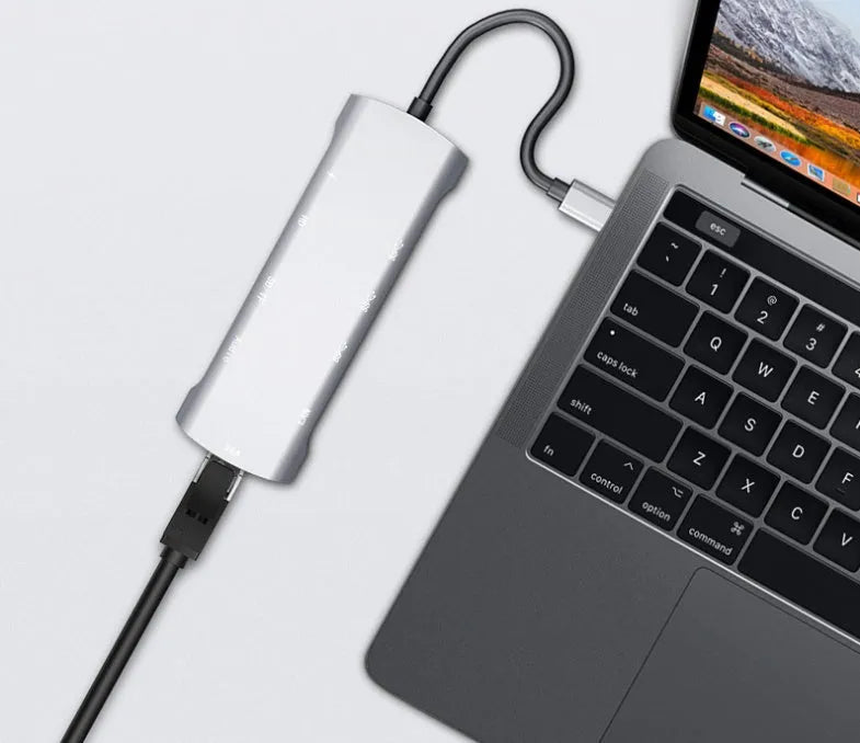 Grey USB-C docking station with aluminium alloy shell and 140mm cable showing HDMI and VGA ports