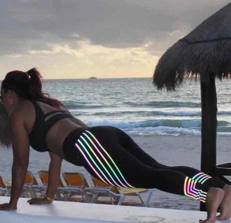 Women's black and white glow-in-the-dark fitness leggings with slim-fit pencil pants design
