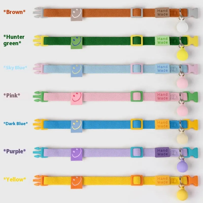 A high-elasticity polyester pet collar for small dogs in a choice of seven solid colours on a white background.