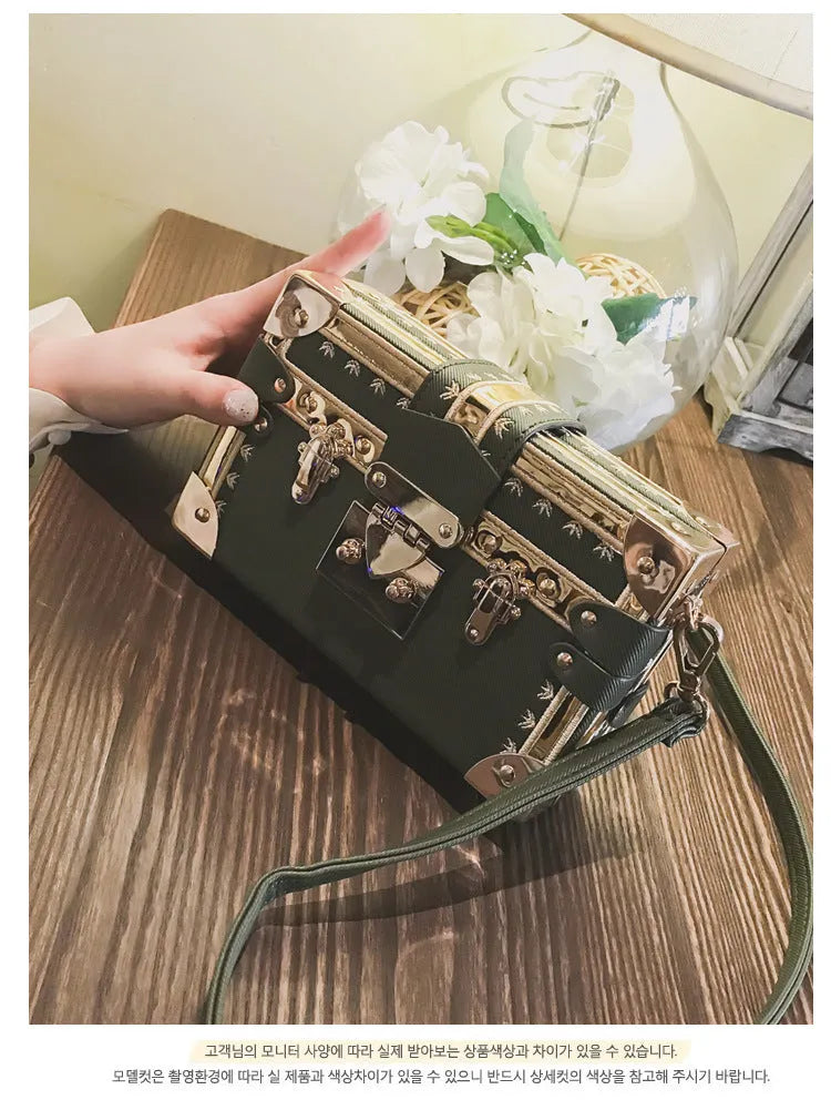 Women's hard-shell PU shoulder bag with flap closure in black or green