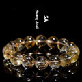 Natural yellow citrine bracelet with geometry-shaped beads in multiple size options on adjustable closure