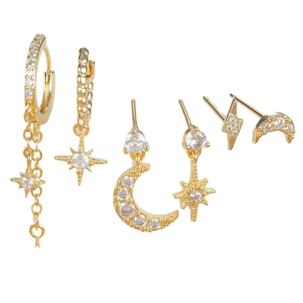 Gold-coloured chain tassel earrings with six dangling elements and zircon stud details on copper construction.