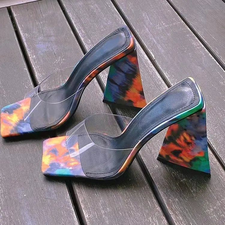 Women's black PU slippers with a square toe and a thick triangular high heel on a rubber sole.