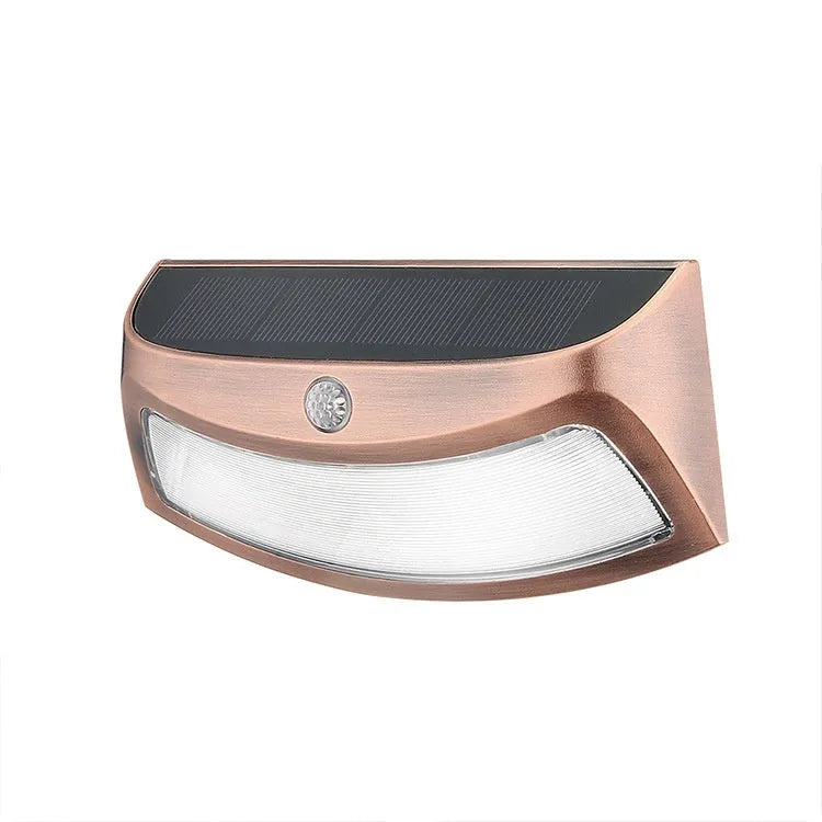 Solar-powered outdoor wall light with retro smiling face design for garden or courtyard.