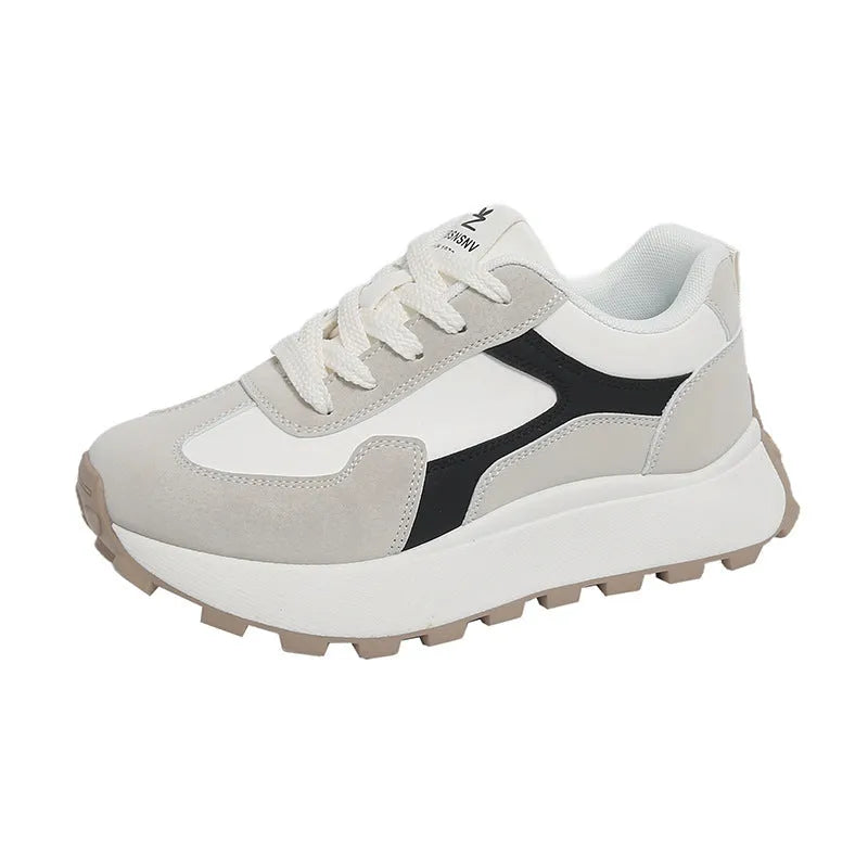 Women's solid colour low top sports shoes with flat platform heel and lace-up front.