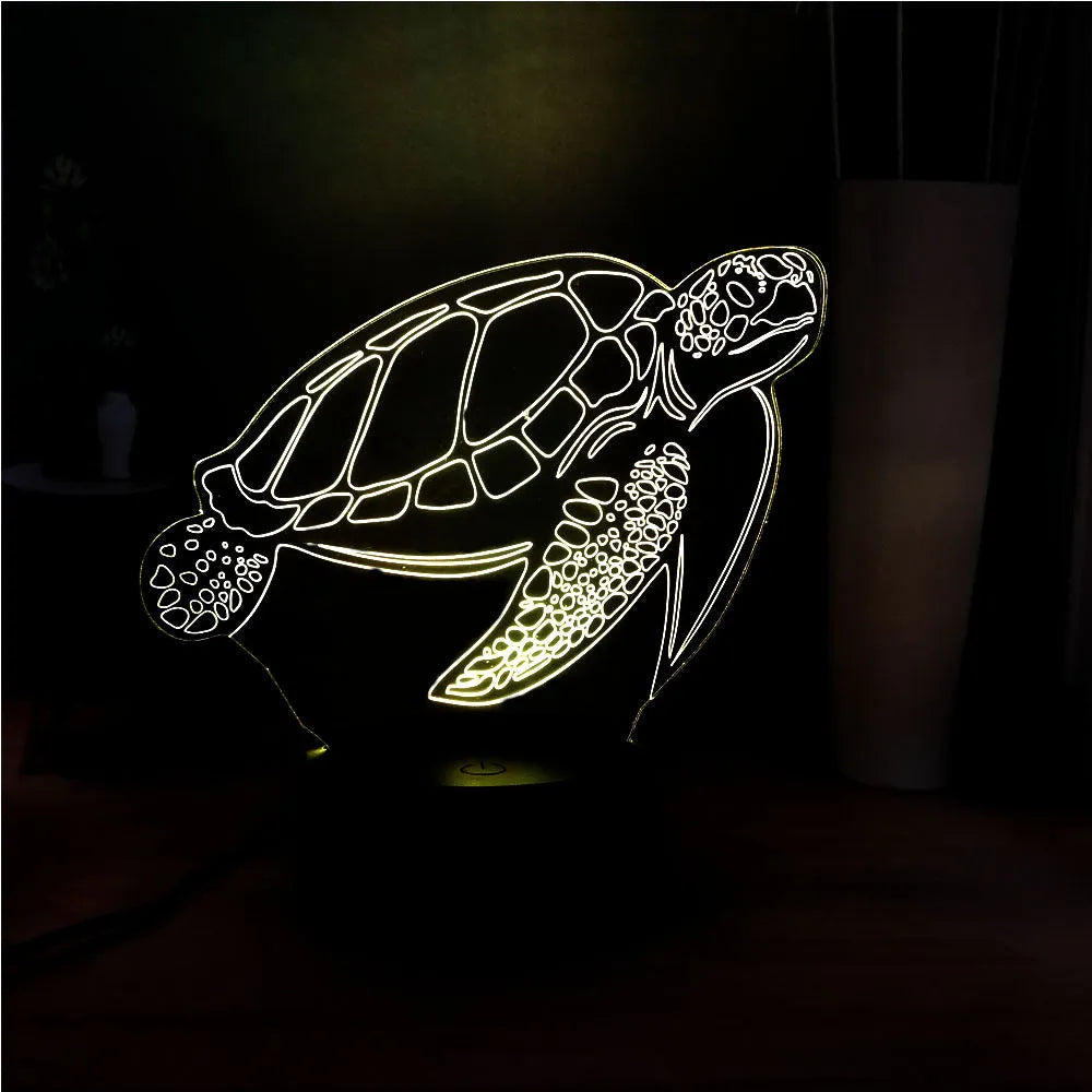 Turtle-shaped acrylic night light with multi-coloured 3D LED glow, showing remote control.