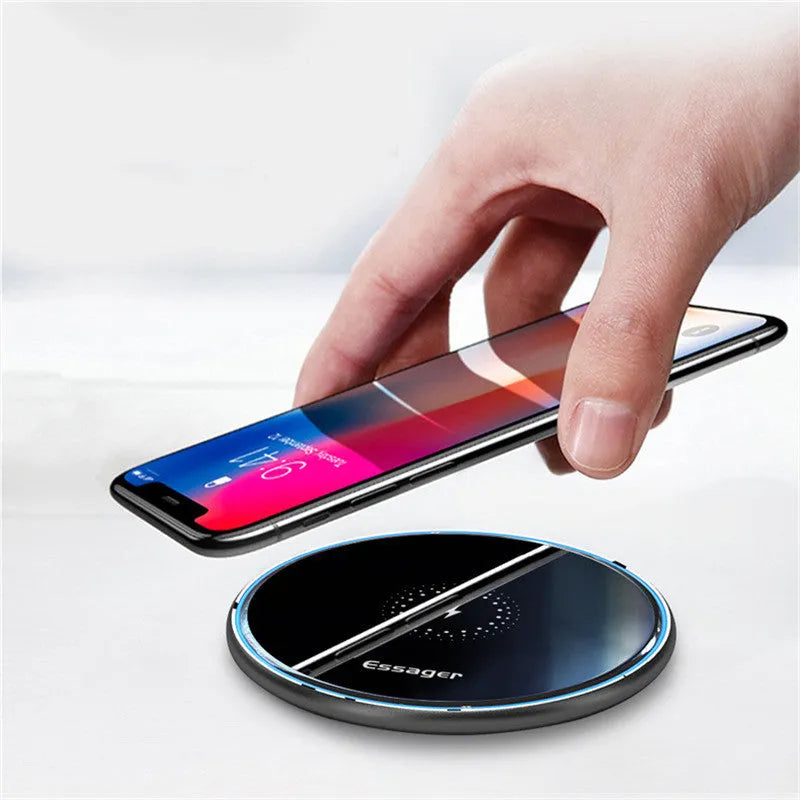 Black wireless charging pad with LED indicator light for smartphones and headphones