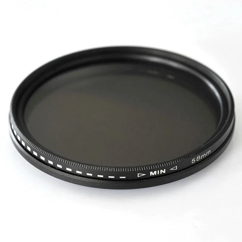 Set of four neutral density camera lens filters with multiple thread size adapters