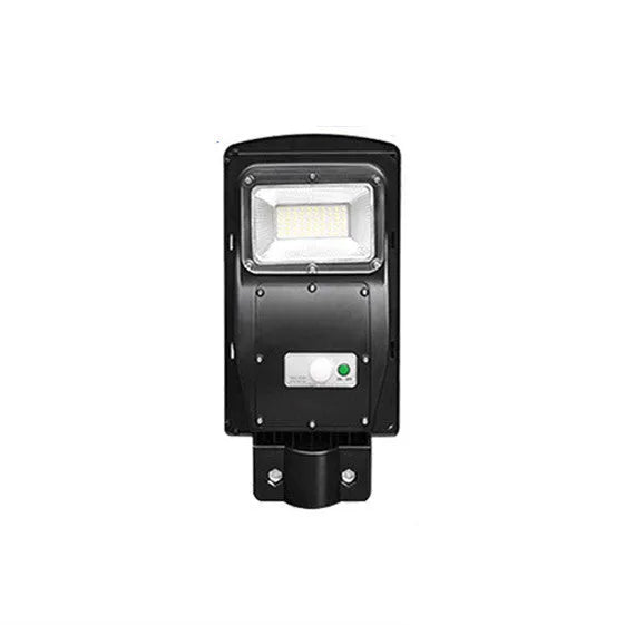 Integrated solar street light unit with solar panel and LED light in single housing for outdoor use