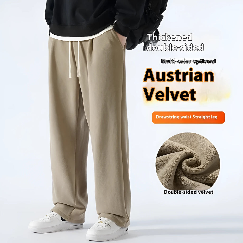 Men's apricot fleece-lined loose-fit sports casual trousers with elastic waist on a hanger.