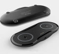 Black and white dual Qi wireless charging pad charging two smartphones simultaneously