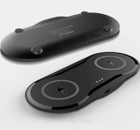 Black and white dual Qi wireless charging pad charging two smartphones simultaneously