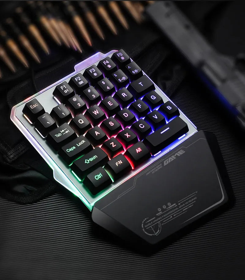 Black G40 one-handed mechanical keyboard with RGB backlighting on a desk.
