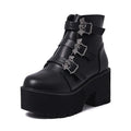 Black women's punk ankle boots with bat buckle, side zipper, thick heel, and round toe.