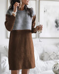 Brown women's long sleeve dress with patchwork detailing and a loose, flowing silhouette.