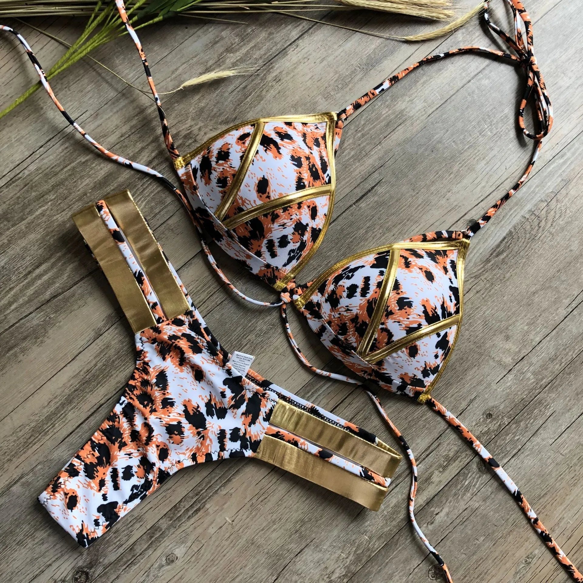 Women's bikini set with push-up pads, no underwire, in leopard print and snakeskin pattern options.