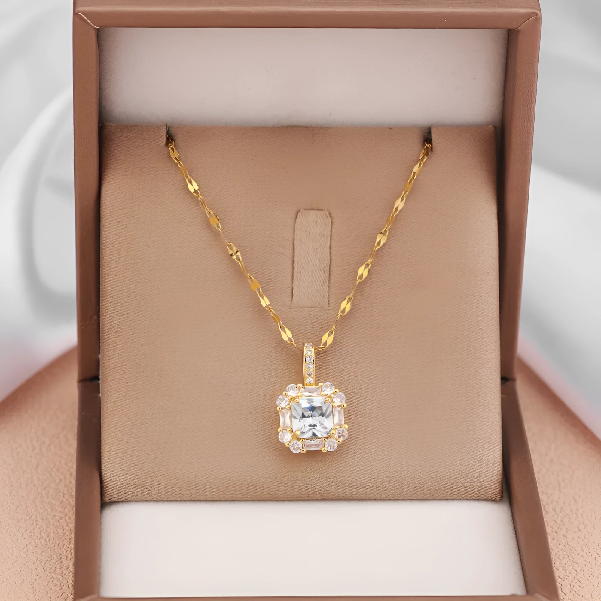 Women's geometric clavicle chain with quadrilateral pendant containing mixed gem inlays on water wave titanium steel chain
