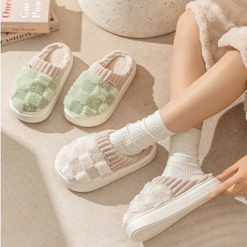 Plaid patterned women's indoor slippers in various colours with a soft sole and plush interior.