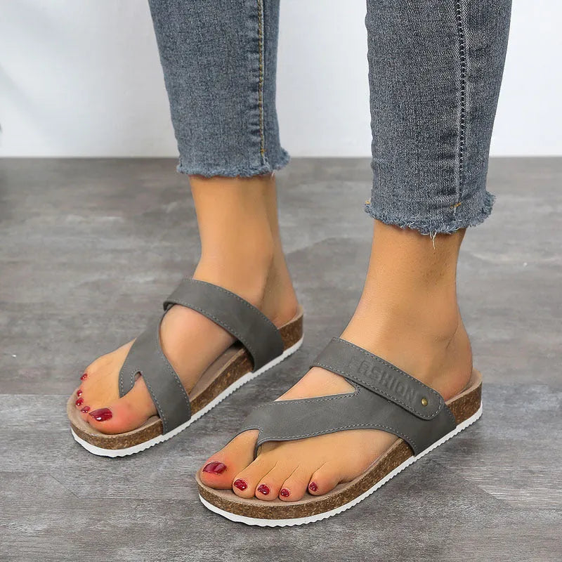 Thick-soled foam flip-flops with a flat toe ring in blue, shown on a white background.