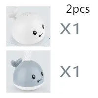 Automatic electric whale bath toy spraying water with flashing coloured lights