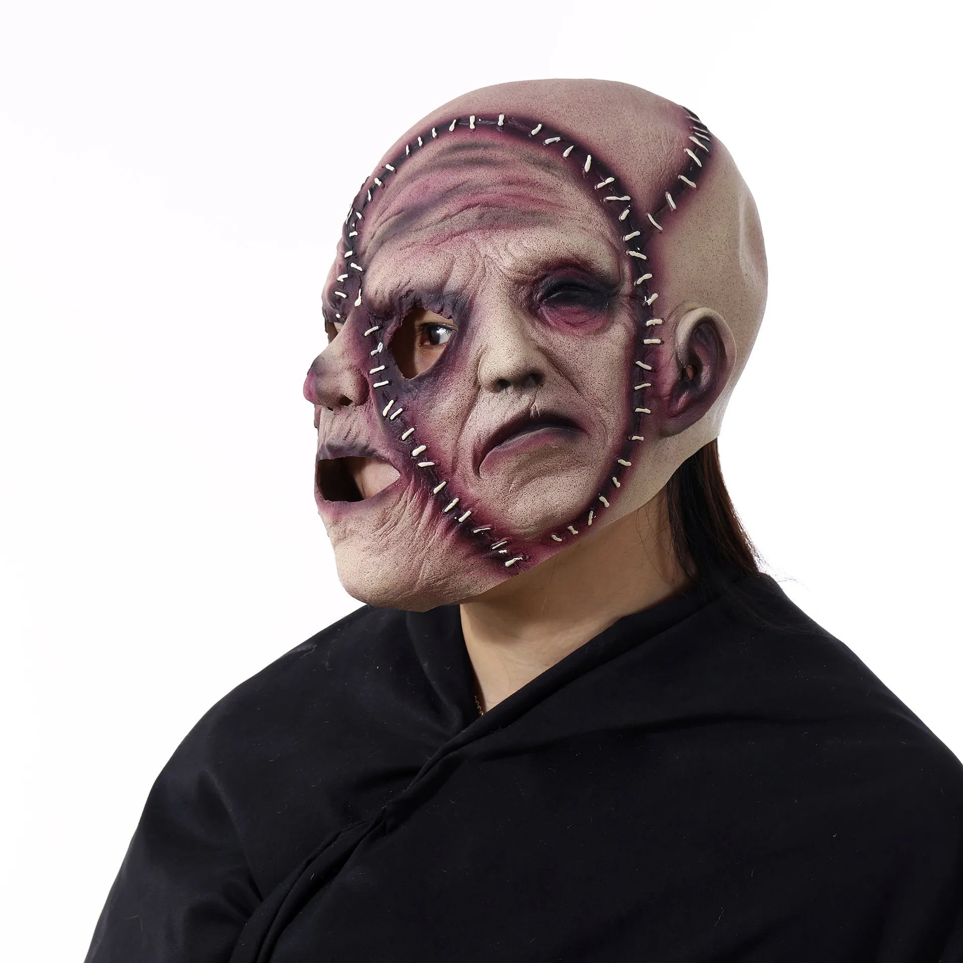 Halloween three-sided grimace horror mask in natural latex showing realistic facial effect
