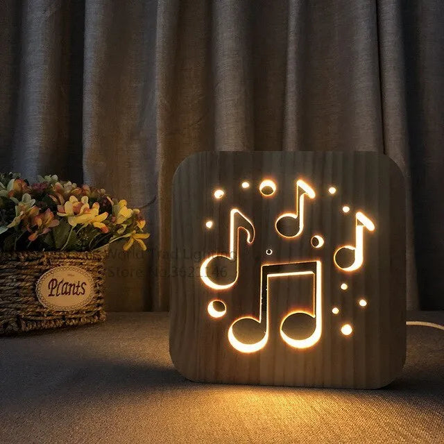 Square pine wood USB LED atmosphere lamp emitting warm white light, showing its 3D design and button switch.