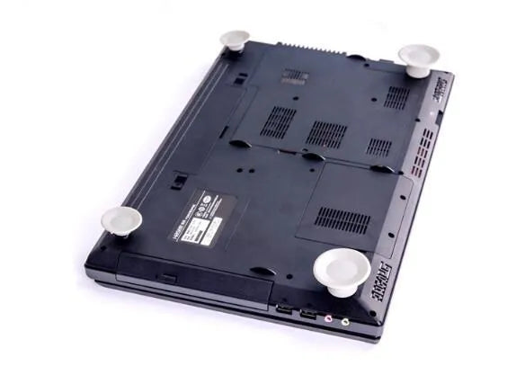 Set of four grey durable plastic laptop cooling pads, two large and two small, on a flat surface.