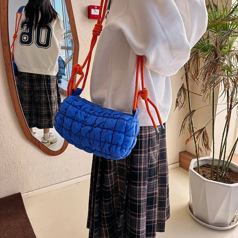 Women's lightweight nylon pillow-shaped messenger bag with a crossbody strap in six colour options.