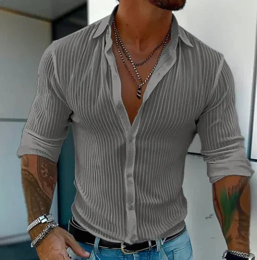 Man wearing a loose-fit, striped, long-sleeve cardigan in a blue colour variant