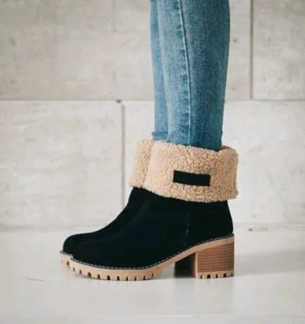 Women's mid-calf suede snow boots in black with a thick flat heel and round toe.
