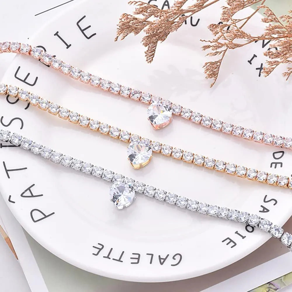 Gold rhinestone heart-shaped collar for dogs or cats on a white background.
