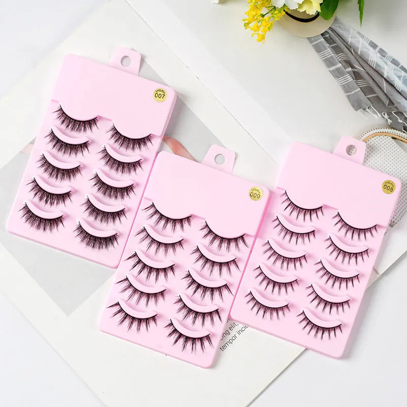 5 pairs of manga-style false eyelashes on a black strip, showing natural wispy Korean makeup look.