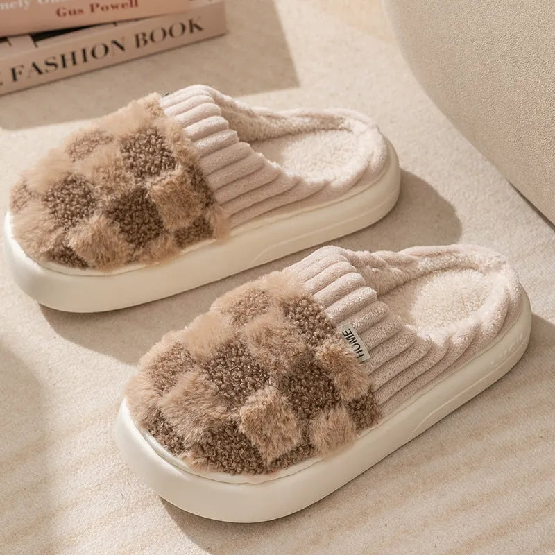 Plaid patterned women's indoor slippers in various colours with a soft sole and plush interior.