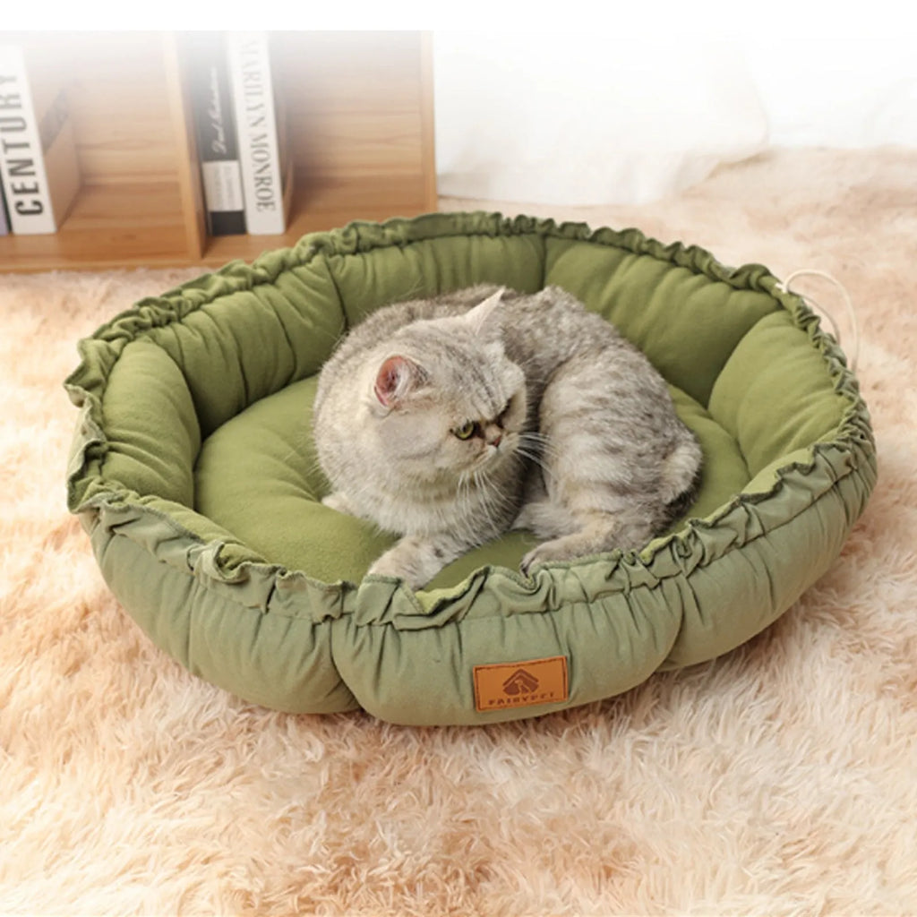 Grey and green reversible donut-shaped cat bed for indoor cats and small dogs