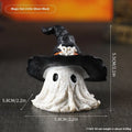 A purple resin wizard hat ornament for Halloween and Christmas decoration.