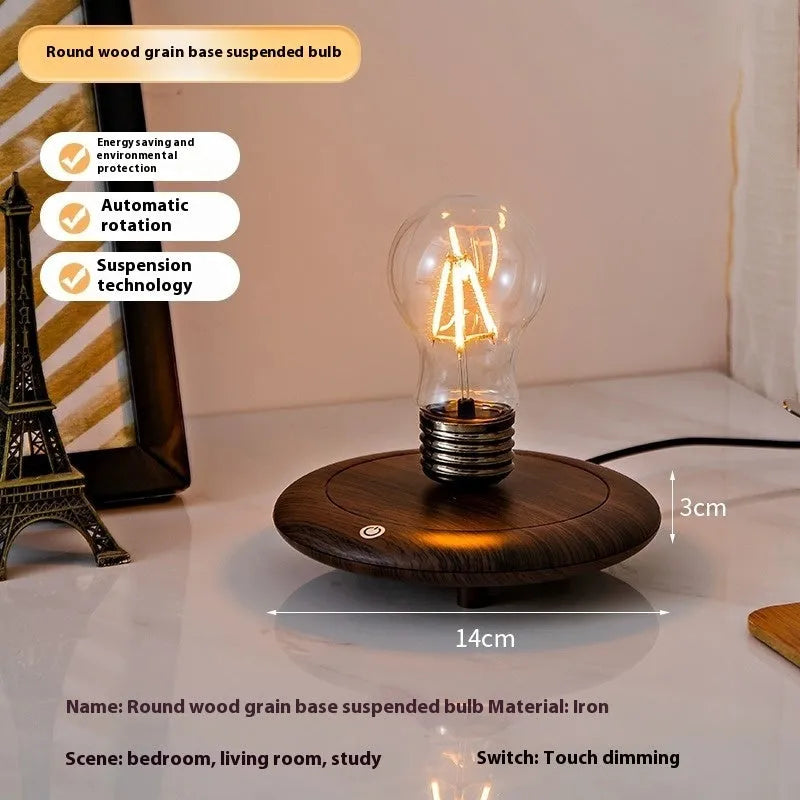 Iron art suspension bulb desktop night lamp on a square wooden base.