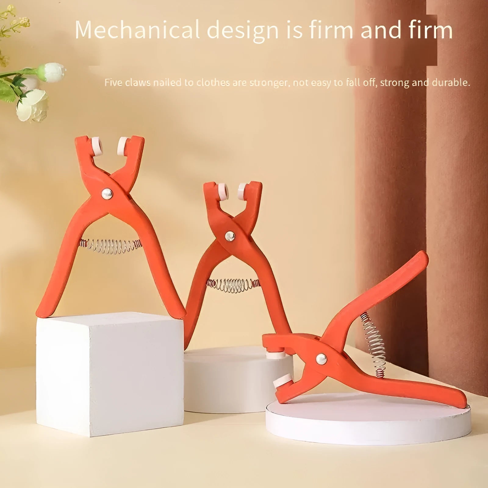 Stainless steel five claw no-sew button and application pliers for children's clothing.