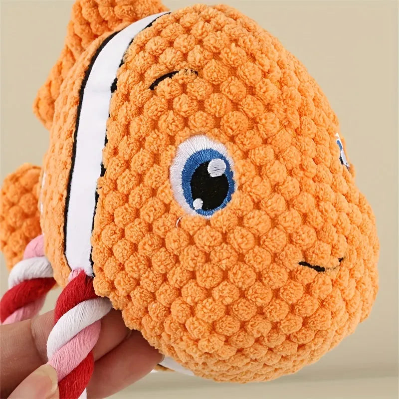 Green turtle shaped dog chewing toy with three rope knots extending from plush shell