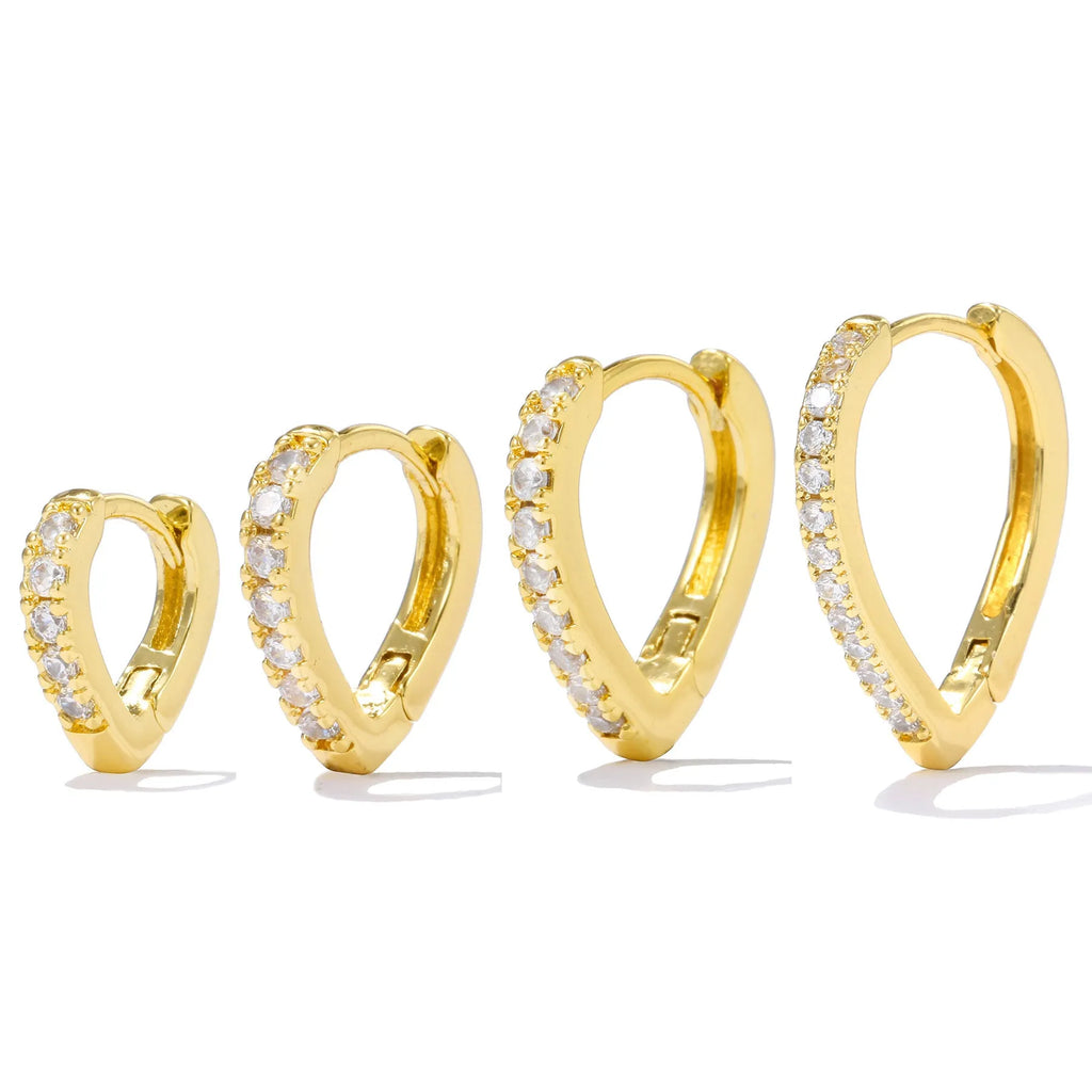 A geometric heart-shaped copper ear clip with a gold or white electroplated finish.