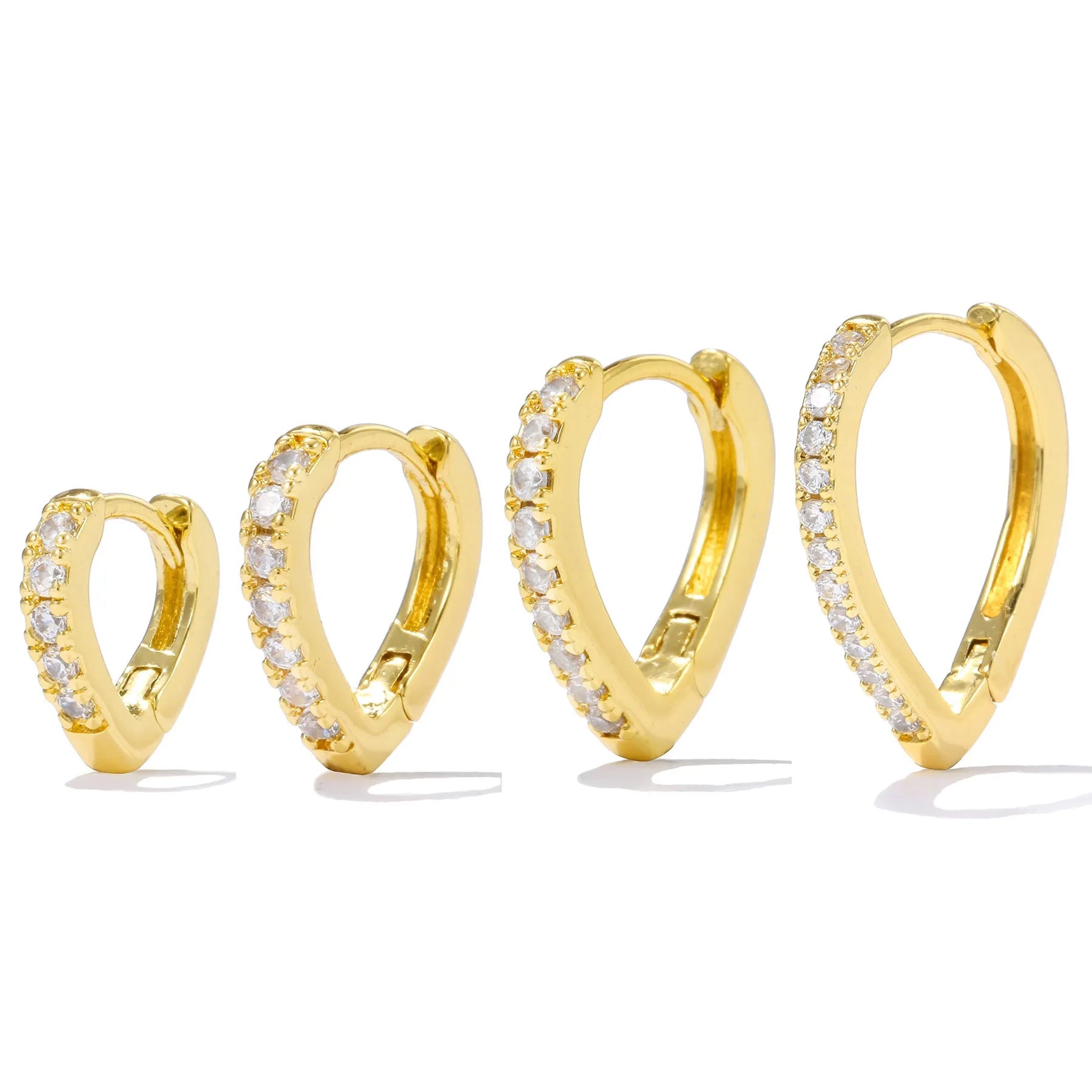 A geometric heart-shaped copper ear clip with a gold or white electroplated finish.