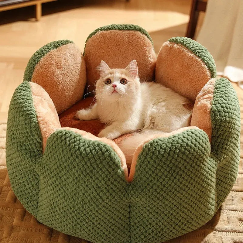 Green cactus petal shaped enclosed pet bed for cats and dogs on a hardwood floor.