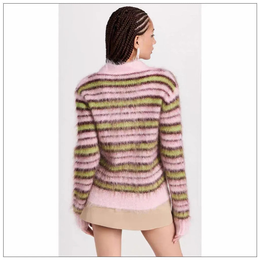 Pink women's wool knitted cardigan on a hanger, showing nap texture and regular sleeves.