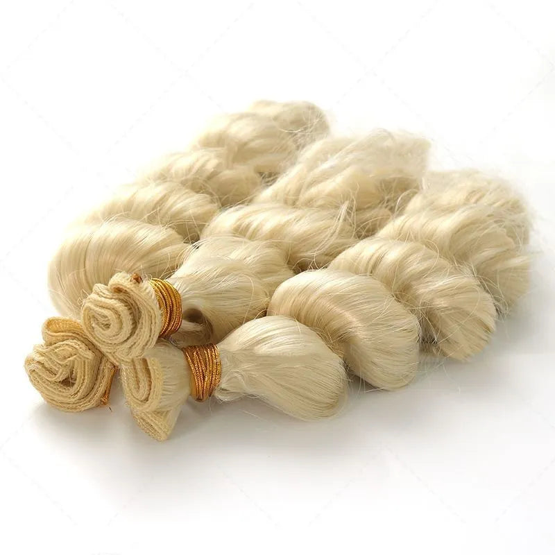 Golden synthetic hair weft wig showing long, straight strands in a golden yellow colour.