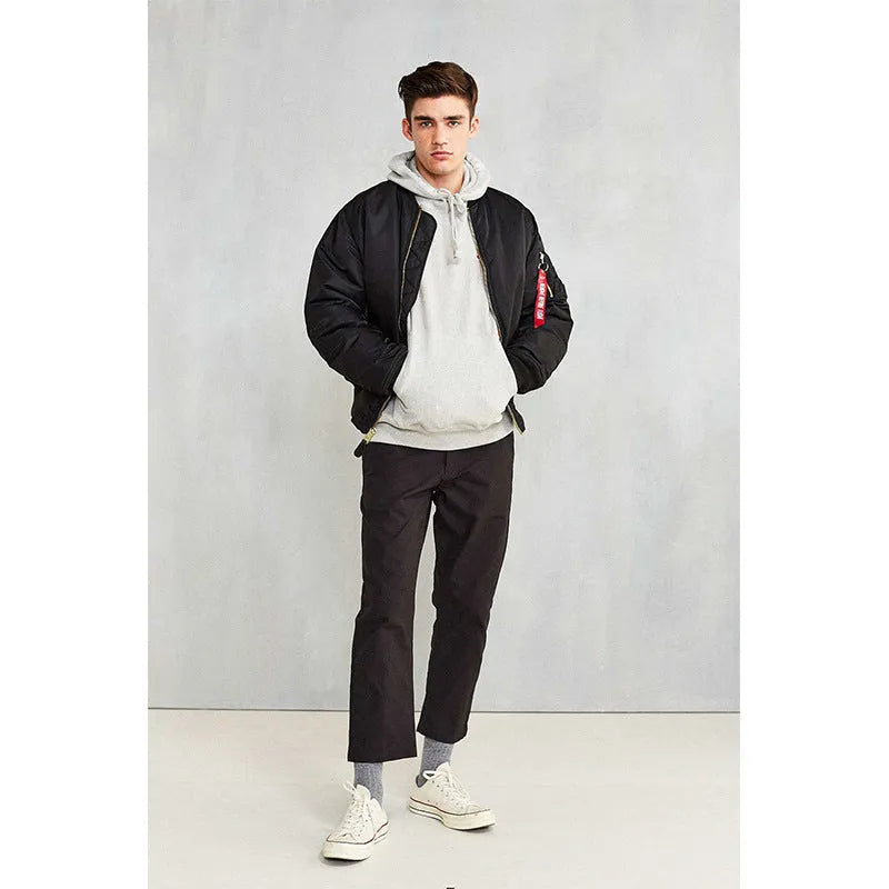 Men's loose-fit army green nylon pilot jacket on a hanger